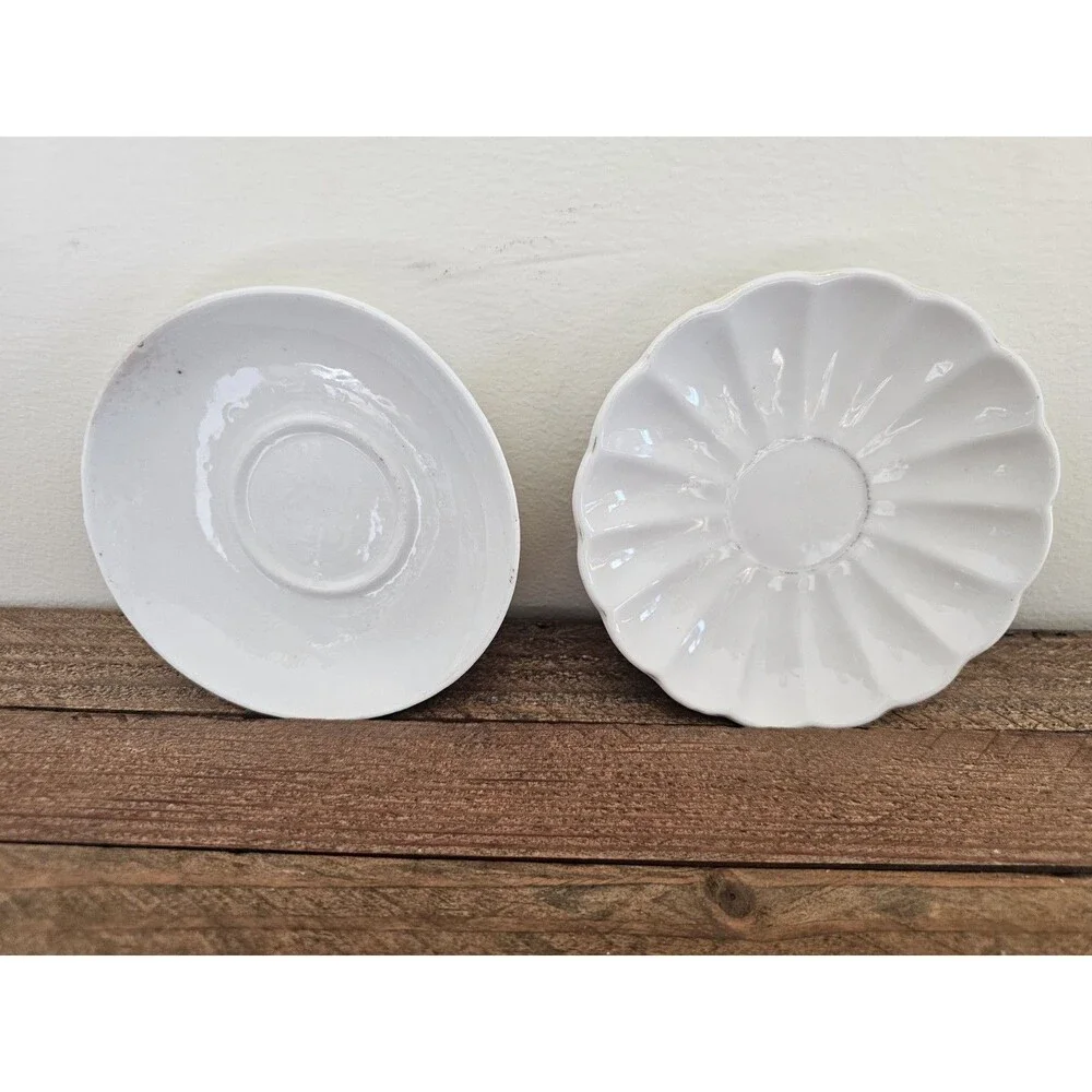 2 White Demitasse Saucers